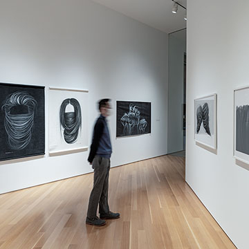 A man views Hong Chun Zhang's work in the Kansas Focus Gallery at the Nerman Museum of Contemporary Art